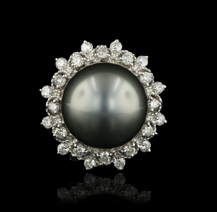 14KT White Gold Tahitian Cultured Pearl and 0.57ctw Dia: 14KT White Gold Tahitian Cultured Pearl and 0.57ctw Diamond Ring A4286. Excellent Condition! DL298PC. One electronically tested 14KT white gold ladies cast tahitian cultured pearl and diamond ring wit