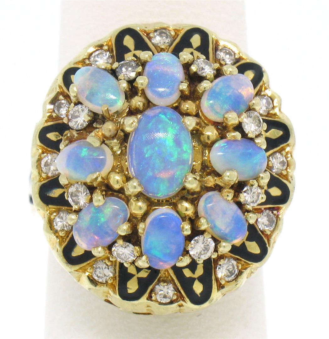 Vintage 14k Yellow Gold Oval Opal Diamond & Black Enamel Ladies Cocktail Ring: A vintage solid 14k yellow gold cocktail ring, featuring 9 oval cabochon cut natural crystal opal (2.50ctw), and 20 round brilliant cut natural diamonds (F/G- VS1/VS2; 0.40ctw), and balck enamel work.