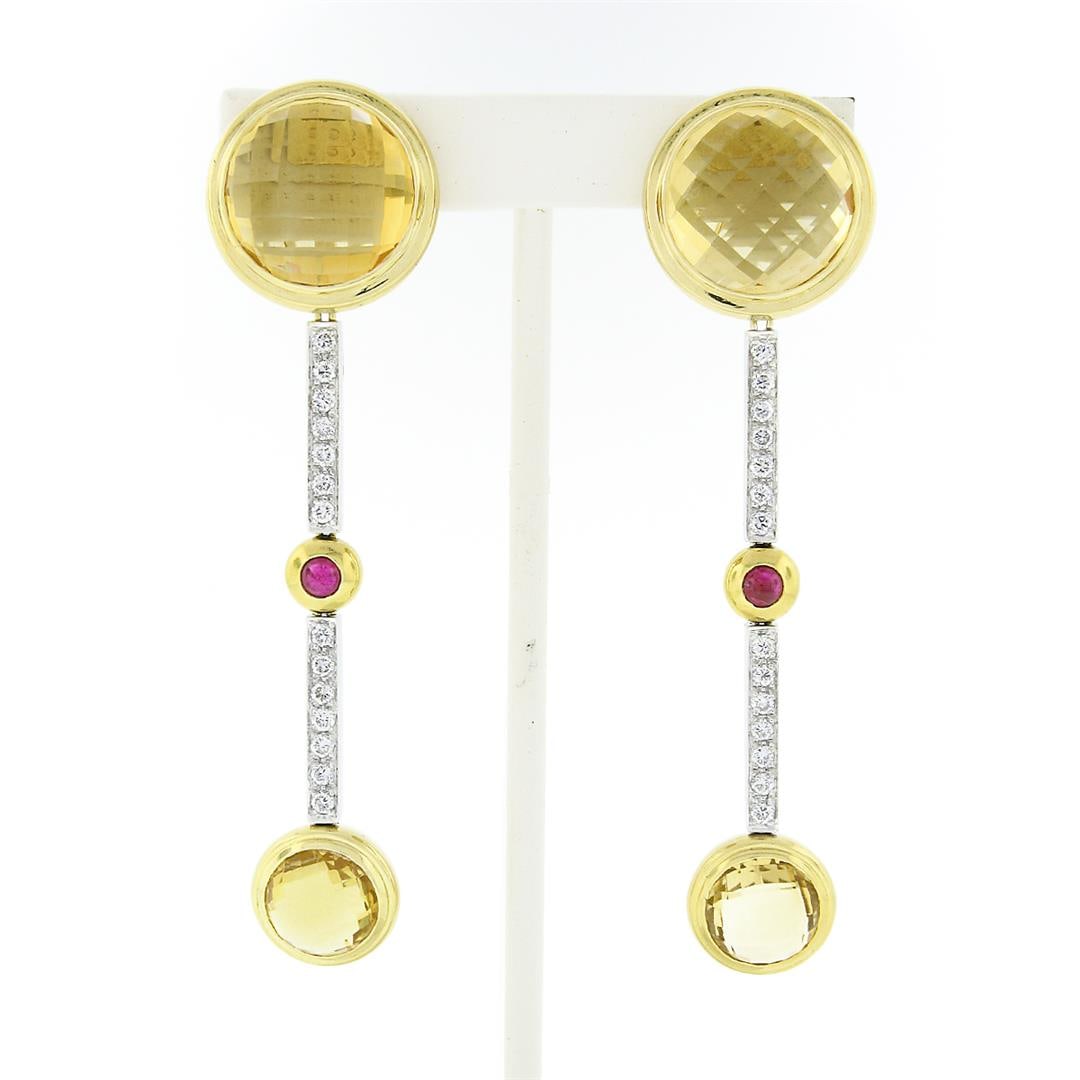 Antonini 18K TT Gold Bezel Citrine Diamond & Ruby Long Dangle Day Night Earrings: A solid 18k yellow & white gold long dangle day night earrings by Antonini, featuring 4 round checkerboard domed rose cut natural citrines (15.1mm and 9.6mm), 2 round cabochon cut natural rubies (3.2m