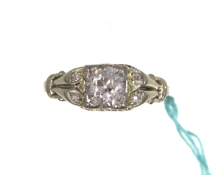 18KT White Gold 1.04tcw Diamond Vintage Wedding Ring A3: 18KT White Gold 1.04tcw Diamond Vintage Wedding Ring A3951. Excellent Condition! TC1001LK. One ladies' diamond vintage wedding ring, stamped and tested 18KT white gold, containing 1 old mine cut cente