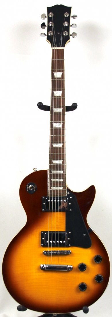 Unnamed Les Paul Standard Tribute Guitar DGUI102: Unnamed Les Paul Standard Tribute Guitar DGUI102. Great Condition! GP941KJ. This un-named Les Paul Standard tribute guitar has all the looks of the Gibson Sunburst flametop guitar at thousands less. A