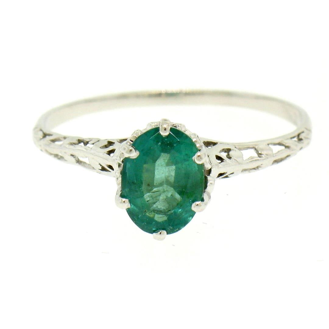 Vintage 14k White Gold 1.38 ctw Prong Set Oval Cut Emerald Filigree Solitaire Ri: A vintage solid 14k white gold solitaire ring, with 1 oval cut natural emerald (1.38ct ). The ring is size 10.5, weighs a total of 3.1 grams, and measures 9.15mm wide.