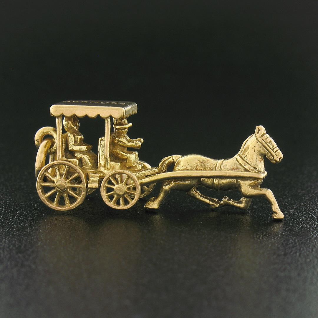 Vintage British 9K Gold Bermuda Horse Drawn Carriage Ride Buggy Charm Pendant: A vintage solid 9k yellow gold buggy charm pendant. The pendant weighs a total of 3.80 grams, measures 11x29.80mm including the bail, and the inside of the bail measures 3.1mm.