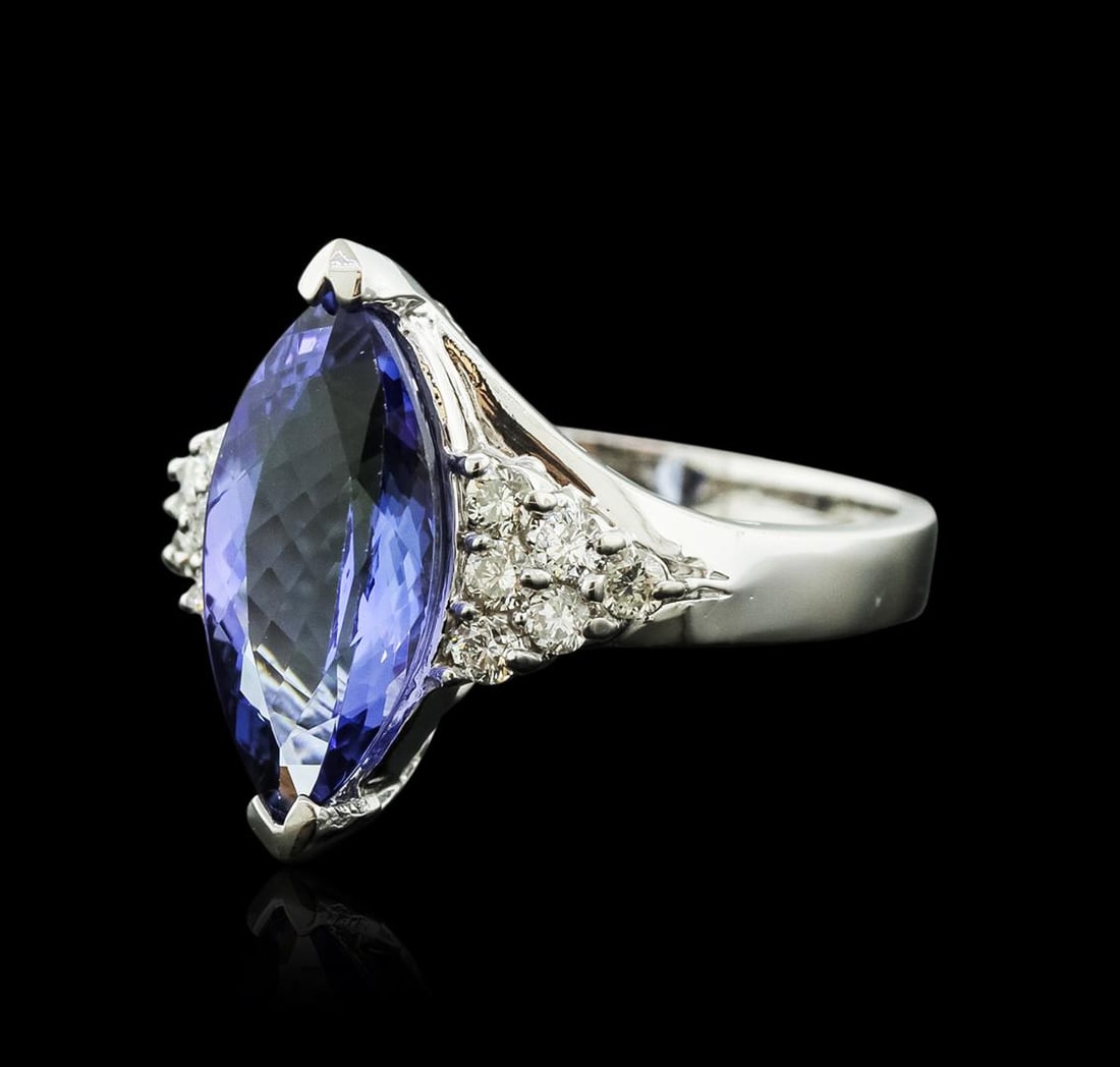 14KT White Gold 3.70 ctw Tanzanite and Diamond Ring: One electronically tested 14KT white gold ladies cast tanzanite and diamond ring with a bright polish finish. Identified with markings of "14K". Condition is new. Containing: One prong set marquise mo