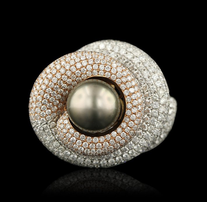 14KT Two-Tone Gold Tahitian Cultured Pearl and 9.04ctw : 14KT Two-Tone Gold Tahitian Cultured Pearl and 9.04ctw Diamond Ring GB525. Good Condition! GH9004MA. One electronically tested 14KT two-tone, rose & white gold ladies cast Tahitian cultured pearl and 