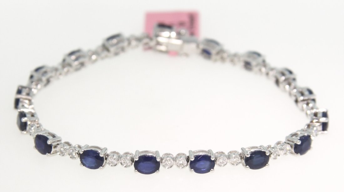 14KT White Gold 7.51ct Sapphire and Diamond Bracelet FJ: 14KT White Gold 7.51ct Sapphire and Diamond Bracelet FJM1105. Excellent Condition! BW618MY. One 14KT white gold Michael Christoff sapphire and diamond bracelet. Features 17 sapphires weighing a total 
