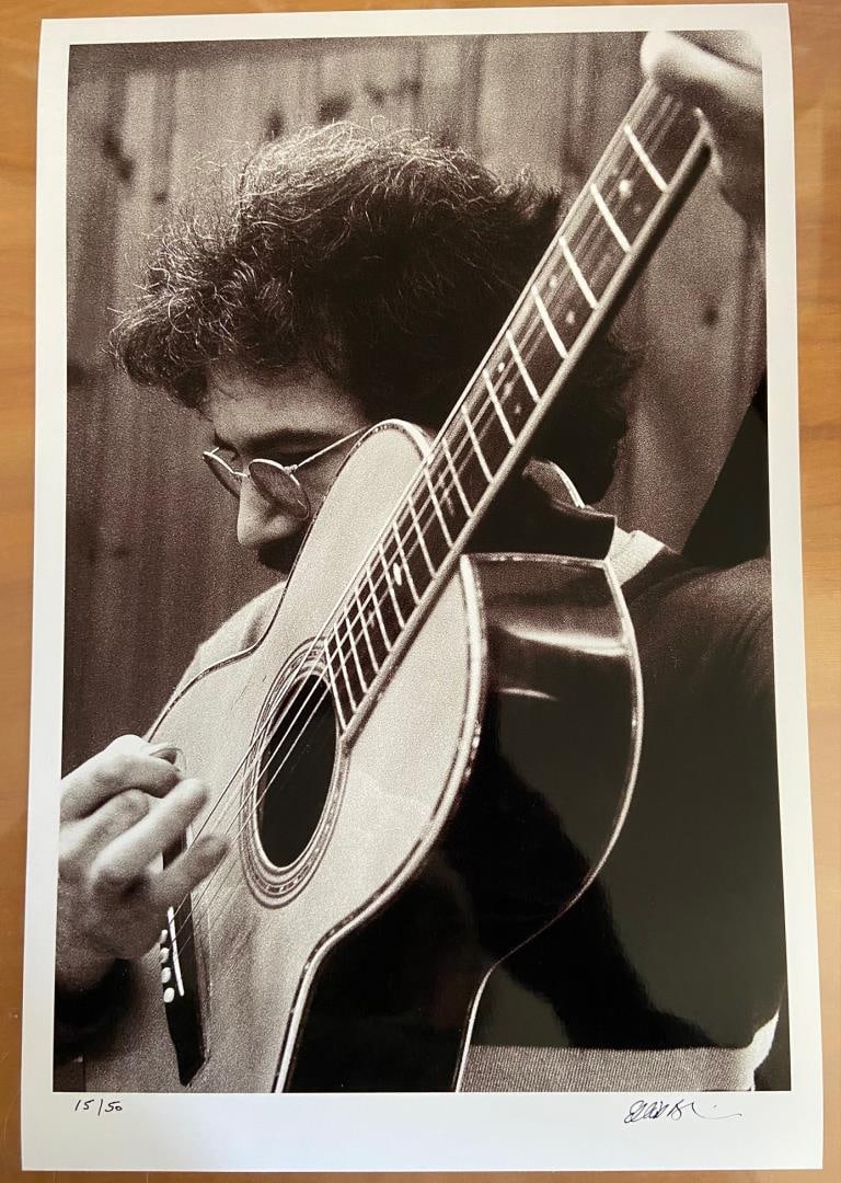 Jerry & Big Guitar by Elliot Blinder: A hand-signed & numbered glossy photograph shot in 1969 for Rolling Stone by photographer/author Elliot Blinder . Image is 16.25x11"on 18x22" paper . Shot backstage at The Boston tea Party club for Ro
