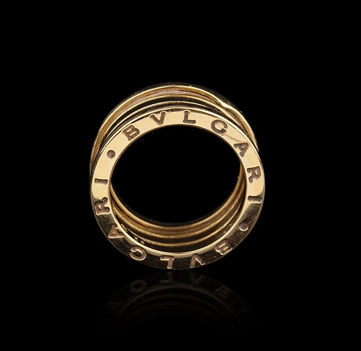 Bvlgari B.ZERO1 4-Band 18KT Yellow Gold Ring GB659: Bvlgari B.ZERO1 4-Band 18KT Yellow Gold Ring GB659. Good Condition! TL977ZP. One Bvlgari B.ZERO1 4-band 18KT yellow gold ring. The ring features: 18KT yellow gold, four bands, unique expandable design