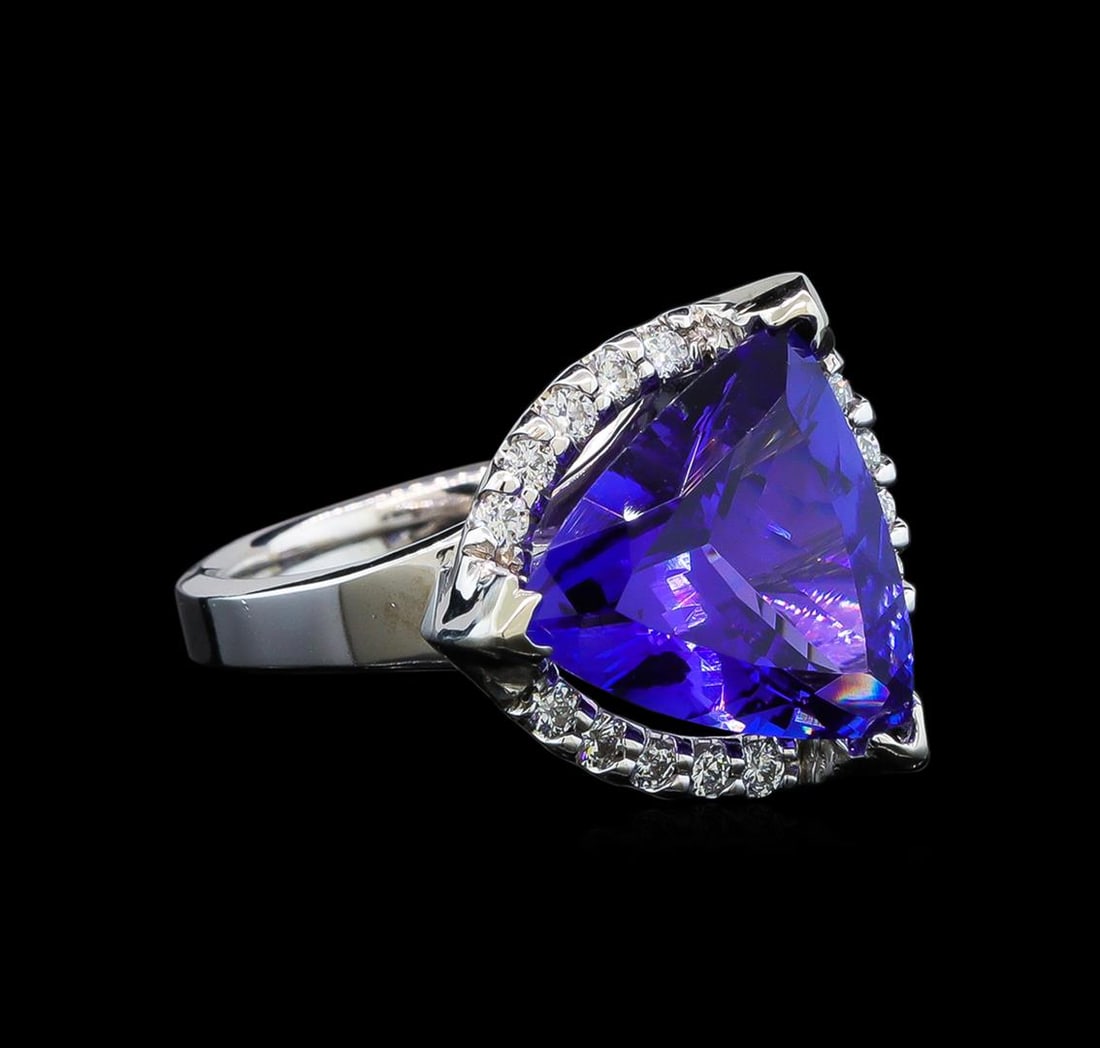 GIA Cert 6.52 ctw Tanzanite and Diamond Ring - 14KT White Gold: One electronically tested 14KT white gold lady's cast fashion ring with a halo with a bright polish finish. The featured lady's ring has a shank measuring 3.15 millimeters wide. Identified with markin