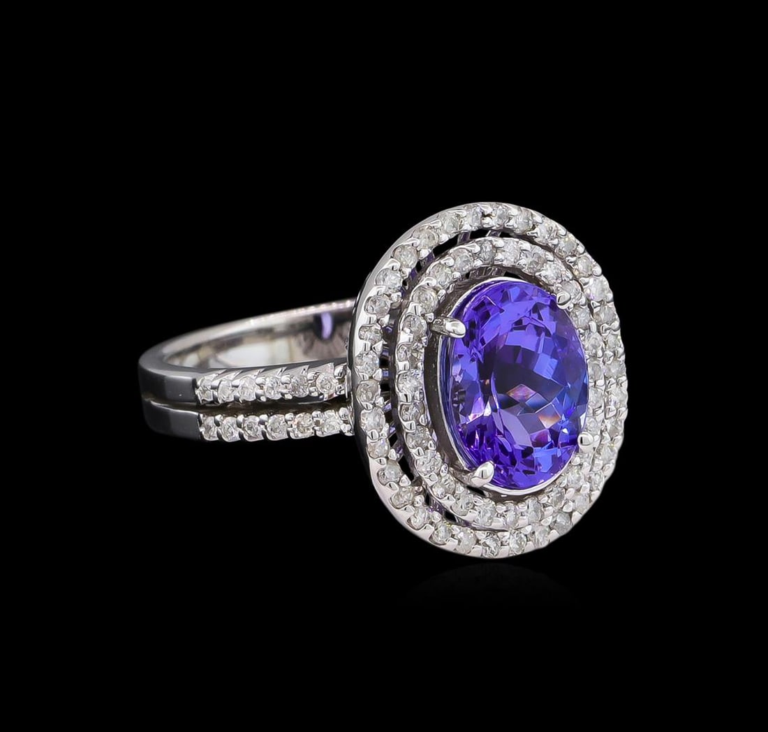 2.11 ctw Tanzanite and Diamond Ring - 14KT White Gold: One ring featuring: 14KT white gold weighing 5.18 grams containing one tanzanite with a total weight of 2.11ct and side diamonds with a total weight of 0.57ct.