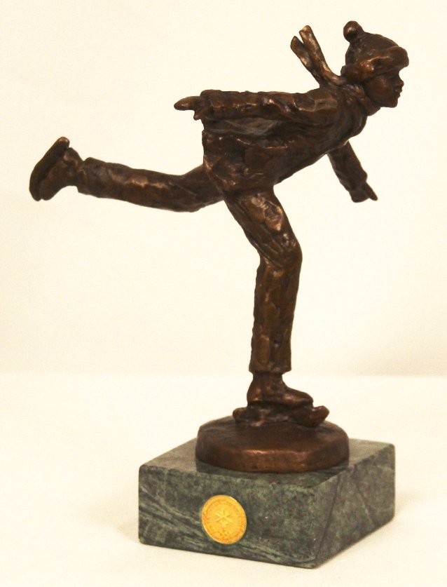 "The Skater" by Dennis Smith Bronze Statue BD222: The Skater" by Dennis Smith Bronze Statue BD222. Excellent Condition! FU16NT. This sculputure depicts a boy ice skating. It is a part of the Salt Lake 2002 Olympic Dreams collection, as shown by the g