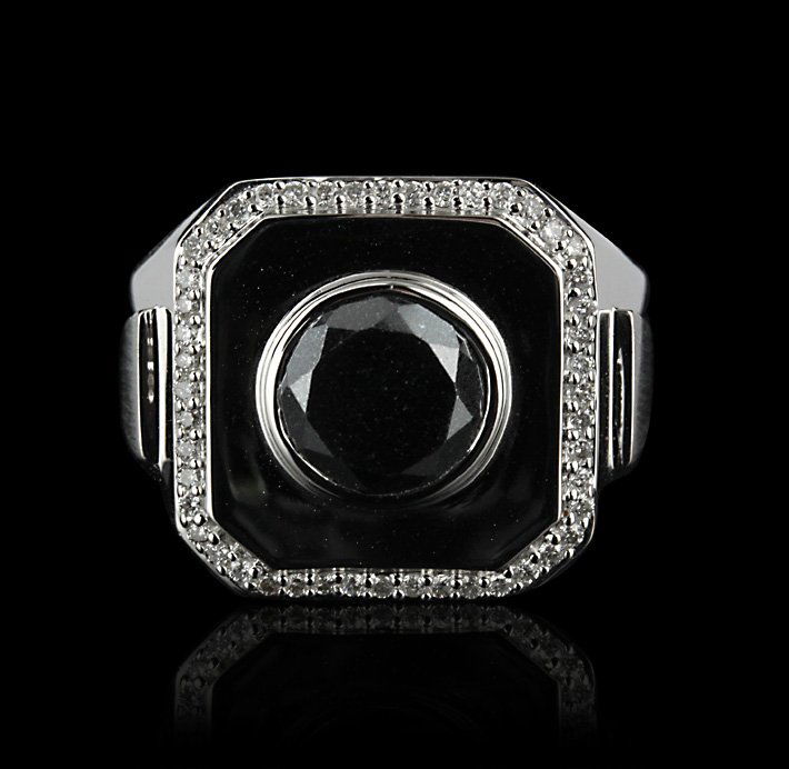 18KT White Gold 3.66ctw Black and White Diamond Ring FJ: 18KT White Gold 3.66ctw Black and White Diamond Ring FJM2029. Excellent Condition! VZ9431KQ. One ring featuring: 12.05 grams of 18KT white gold, (1) 3.35ct black diamond and (48) round cut diamonds wi