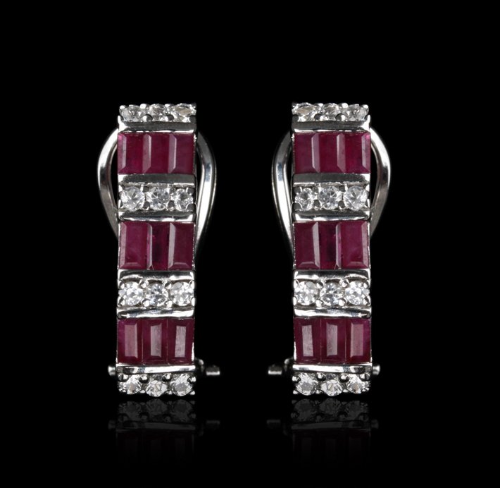SILVER Ruby and White Sapphire Earrings FJM2180: SILVER Ruby and White Sapphire Earrings FJM2180. Excellent Condition! ZG94PT. One pair of earrings featuring: 3.00gm of sterling silver, rubies and white sapphires. Thank you for viewing this lot! We 
