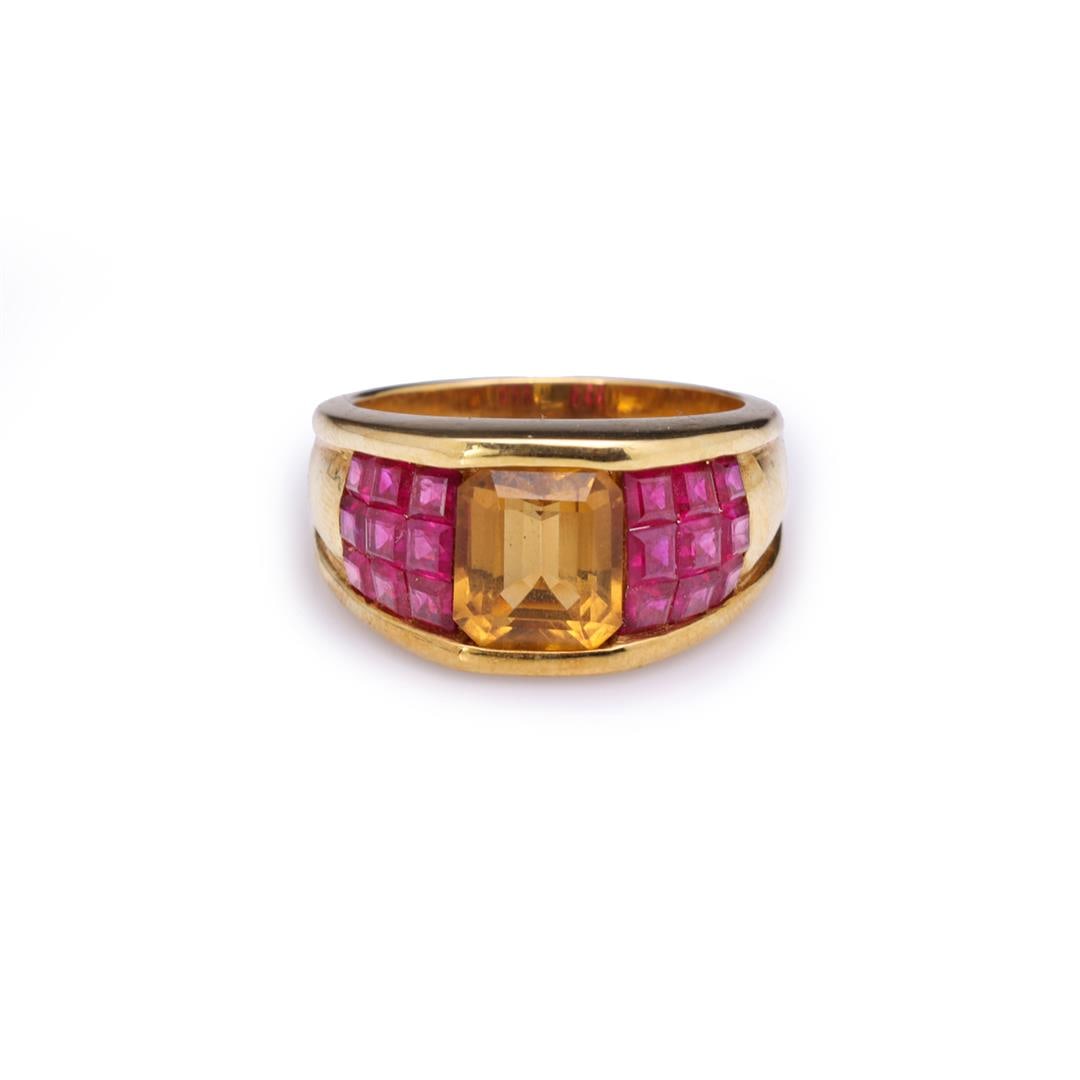 18K Yellow Gold Golden Topaz & Invisible Set Ruby Ring: 18K Yellow Gold Golden Topaz & Invisible Set Ruby Ring containing one emerald cut topaz 8.8mm x 7.9mm weighing approximately 2.50 cts. Eighteen square cut rubies weighing estimated 0.30 cts. Total wei