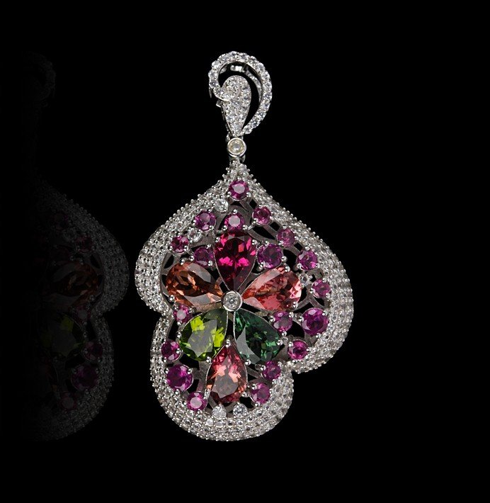SILVER 9.75ctw Tourmaline and White Sapphire Pendant FJ: SILVER 9.75ctw Tourmaline and White Sapphire Pendant FJM2161. Excellent Condition! HJ972QC. One pendant featuring: 12.00gm of sterling silver, (24) tourmaline with a total weight of 9.75cts and white 