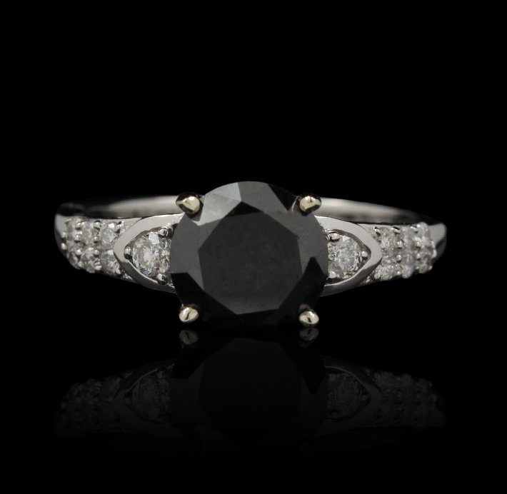 14KT White Gold 0.22ctw Black and White Diamond Ring RM: 14KT White Gold 0.22ctw Black and White Diamond Ring RM895. Excellent Condition! XT964LR. One lady’s polished, stamped and electrically tested solid 14K white gold ring mounted with: 1 Genuine Round