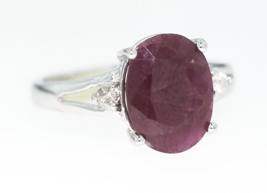 10KT White Gold 4.2ct Ruby and Diamond Ring GD319: 10KT White Gold 4.2ct Ruby and Diamond Ring GD319. Great Condition! SM381EL. One 10KT white gold ruby and diamond ring. Total weight of ruby is 4.20cts. Total weight of diamonds is 0.02cts., totaling