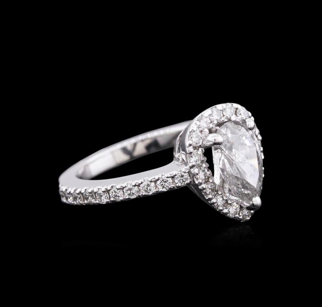 1.51 ctw Diamond Ring - 14KT White Gold: One electronically tested 14KT white gold ladies cast diamond engagement ring with a bright polish finish. Condition is new. Identified with markings of "14K". Containing: One prong set pear shaped cu