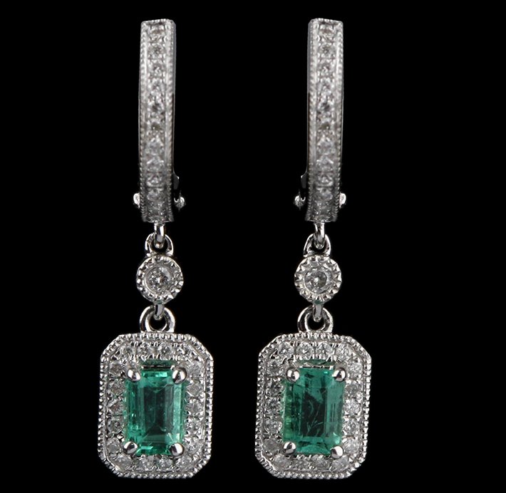 14KT White Gold 0.55ctw Emerald and Diamond Earrings FJ: 14KT White Gold 0.55ctw Emerald and Diamond Earrings FJM2183. Excellent Condition! CV963MK. One pair of earrings featuring: 2.95gm of 14KT white gold, (2) emeralds with a toal weight of 0.55cts and (8