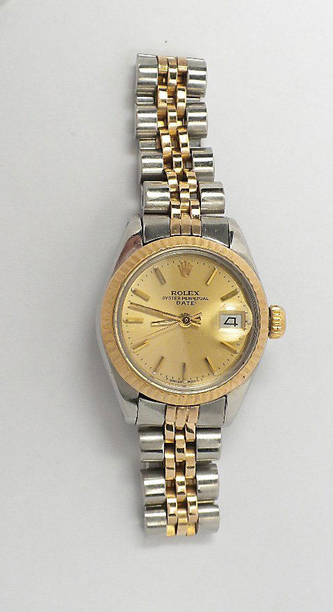 Ladies Rolex Two Tone Date Model Wristwatch A3685: Ladies Rolex Two Tone Date Model Wristwatch A3685. As-Is Condition. WQ5271WL. One ladies, hand crafted & machine milled Rolex Date Model stainless steel & 14KT yellow gold wristwatch electronically te