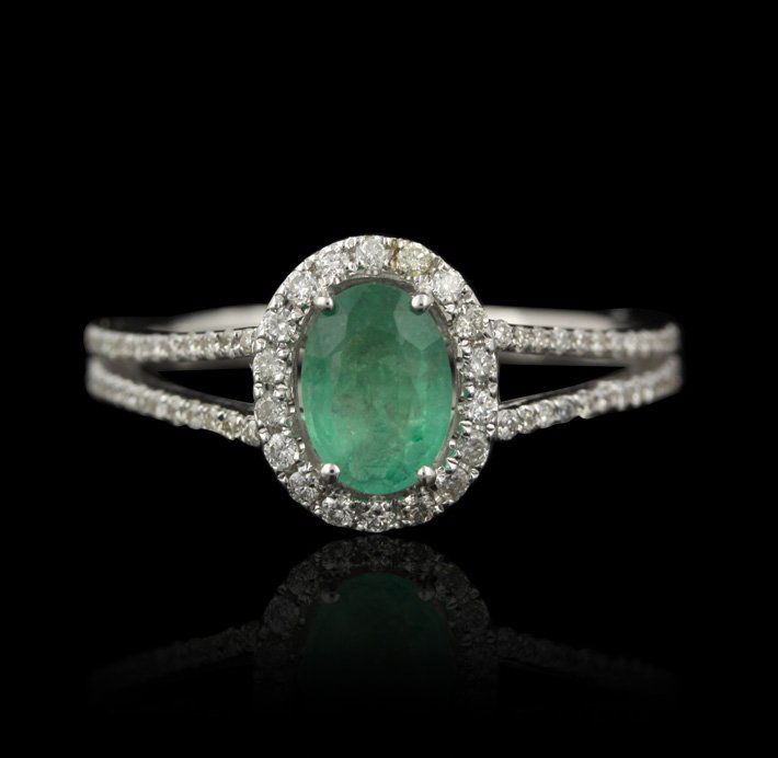 14KT White Gold 0.63ct Emerald and Diamond Ring FJM2254: 14KT White Gold 0.63ct Emerald and Diamond Ring FJM2254. Excellent Condition! JS924SD. One ring featuring: 2.58gm of 14KT white gold, (1) emerald with a total weight of 0.63cts and round cut diamonds