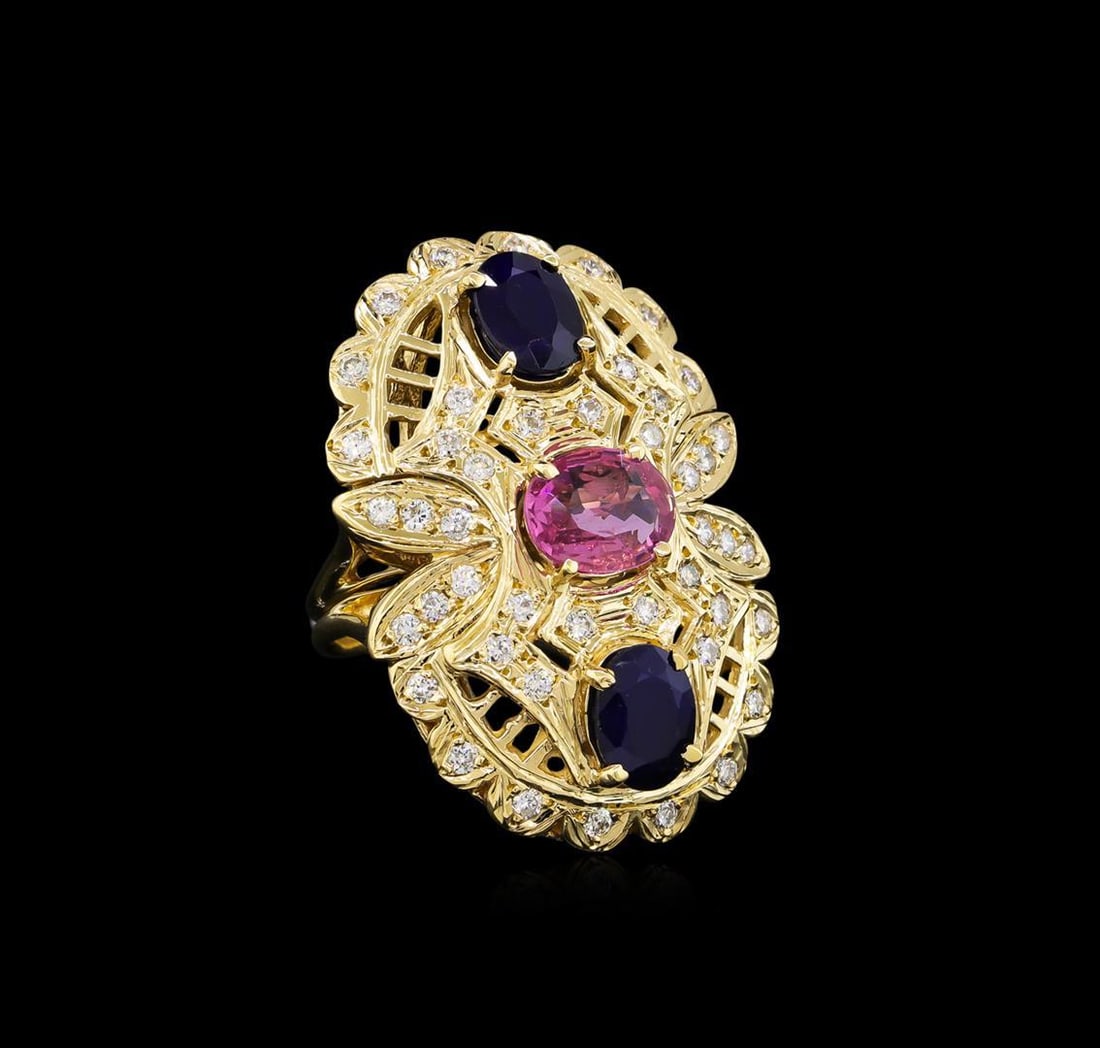 4.58 ctw Sapphire and Diamond Ring - 14KT Yellow Gold: One electronically tested 14KT yellow gold ladies cast multicolor sapphire and diamond ring. The featured pink sapphire is set with two blue sapphires within an elaborate diamond gallery supported by 
