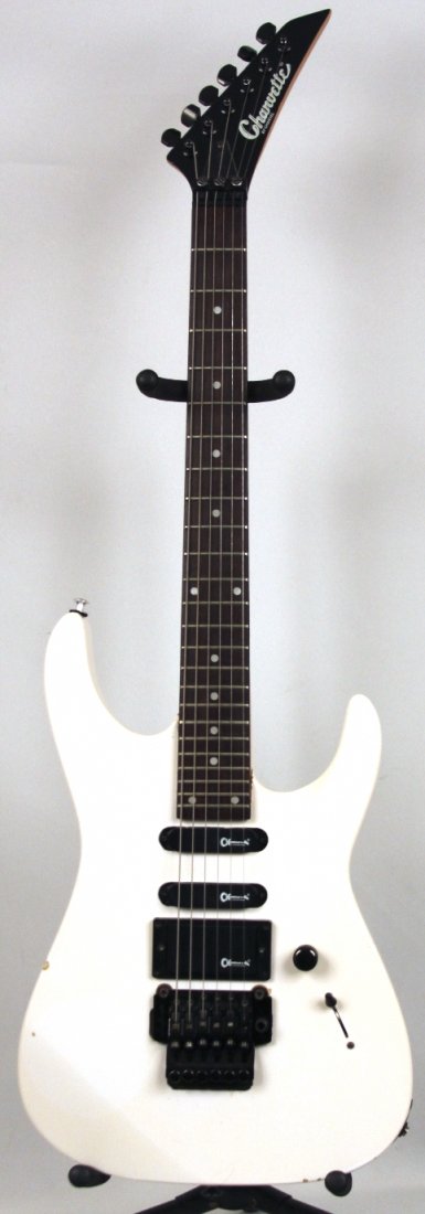 Charvel 1980's Charvette Electric Guitar DGUI90: Charvel 1980's Charvette Electric Guitar DGUI90. As-Is Condition! MN941WE. Very Nice 1980's Charvette by Charvel with 2 enclosed single coil pickups and a humbucker. Includes a 5 way pickup selector s