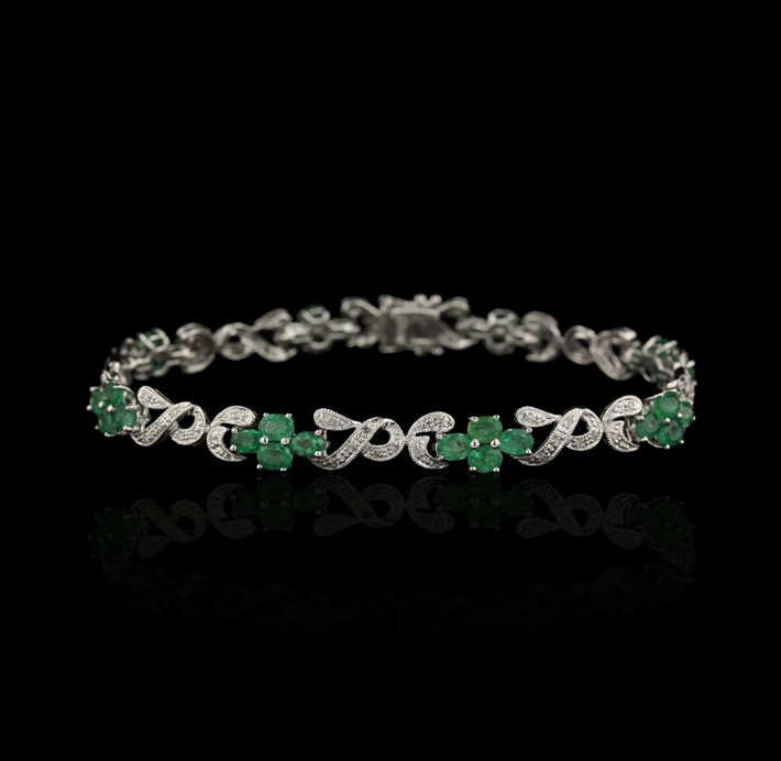 14KT White Gold 5.01ctw Emerald and Diamond Bracelet FJ: 14KT White Gold 5.01ctw Emerald and Diamond Bracelet FJM2466. Excellent Condition! JT938ES. One bracelet featuring: 9.91gm of 14KT white gold, (32) emeralds with a total weight of 5.01ctw and (64) rou