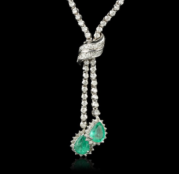 14KT White Gold 6.80ctw Emerald and Diamond Necklace FJ: 14KT White Gold 6.80ctw Emerald and Diamond Necklace FJM2379. Excellent Condition! GQ9962SZ. One lady’s polished, stamped and electronically tested solid 14K white gold necklace mounted with: 2 Genu