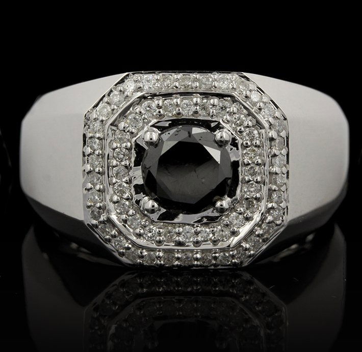 18KT White Gold 1.51ctw Black and White Diamond Ring FJ: 18KT White Gold 1.51ctw Black and White Diamond Ring FJM2323. Excellent Condition! XN9001LU. One ring featuring: 13.40gm of 18KT white gold, (1) black diamond with a total weight of 1.12cts and round