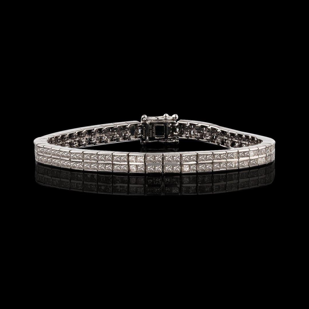 5.15 ctw Diamond 14KT White Gold Tennis Bracelet: One electronically tested 14KT white gold ladies cast and assembled diamond bracelet. Condition is new, good workmanship. Seven inch length double row diamond tennis bracelet, completed with a hidden 