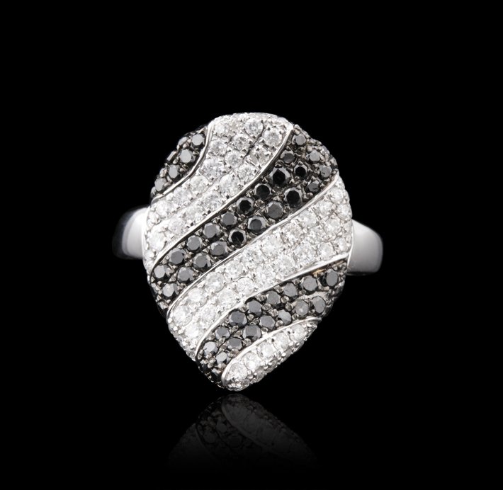 18KT White Gold 1.38ctw Black & White Diamond Ring FJM2: 18KT White Gold 1.38ctw Black & White Diamond Ring FJM2572. Great Condition! RF197SF. One ring featuring: 6.49gm of 18KT white gold, (56) black diamonds with a total weight of 0.68ctw and (65) round c