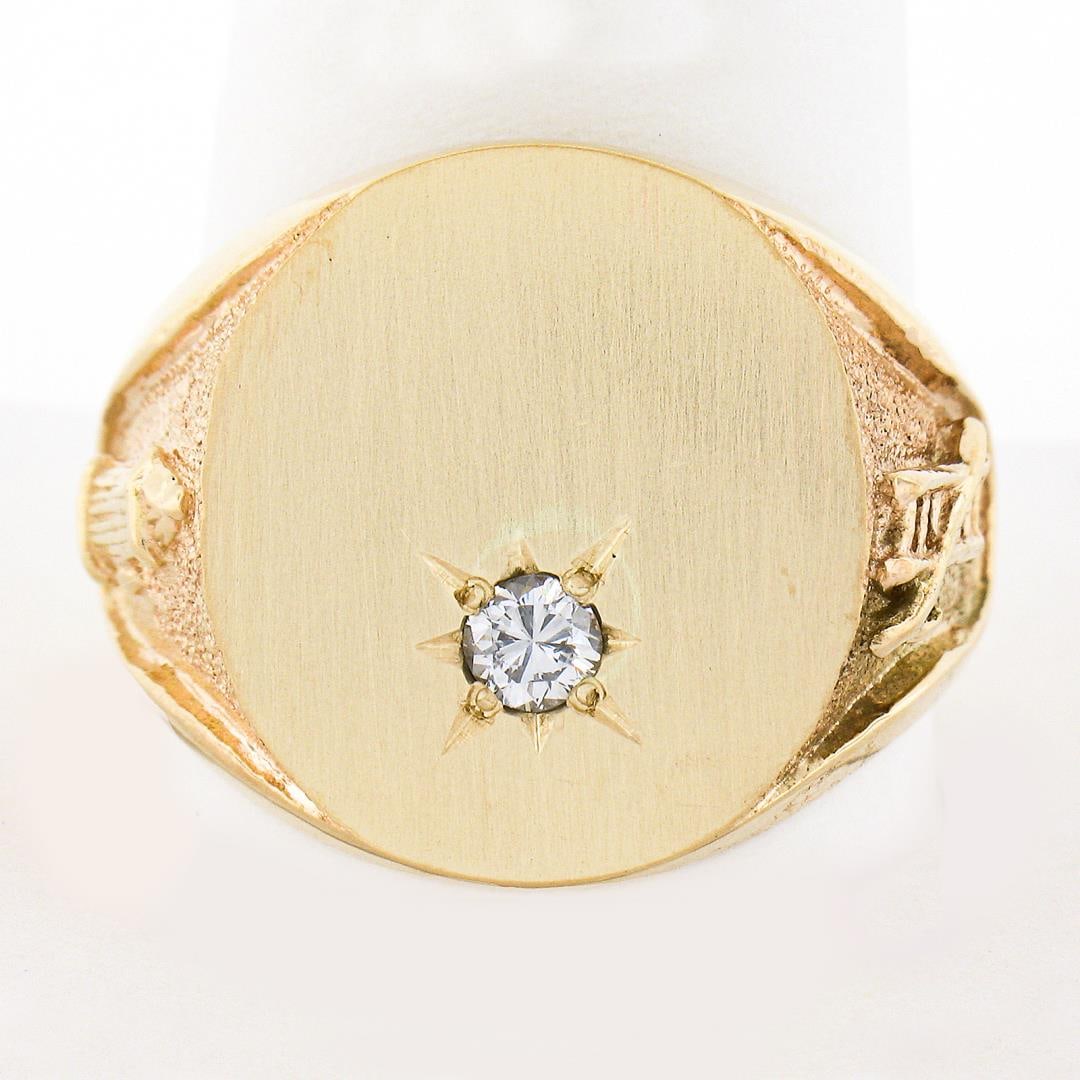 Men's 14K Gold 0.17 ctw Diamond Engraveable Firefighter Textured Oval Signet Rin: A solid 14k yellow gold oval signet ring, with 1 round brilliant cut natural diamond (G - SI1 - 0.17ct). The ring is size 11.5, weighs a total of 14.82 grams, and measures 19.20mm wide.