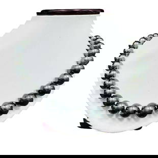 Pearl and Diamond Necklace - 14KT White Gold: One graduated single strand pearl necklace 18.5" princess length, knotted with a tongue clasp & foldover safety containing 35 Tahitian pearls, 14.0mm to 11.0mm in size. The pearls are black in color,