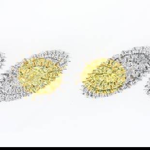 NEW 18K TT Gold 1.0 ctw Fancy Yellow & White Diamond Dual Halo Oval Stud Earring: A new solid 18k yellow & white gold stud earrings, with 2 oval cut natural fancy yellow diamonds (VS1/VS2 ; 0.66ctw), 28 round cut natural fancy yellow diamonds (VS1/VS2 ; 0.14ctw), and 40 round cut n