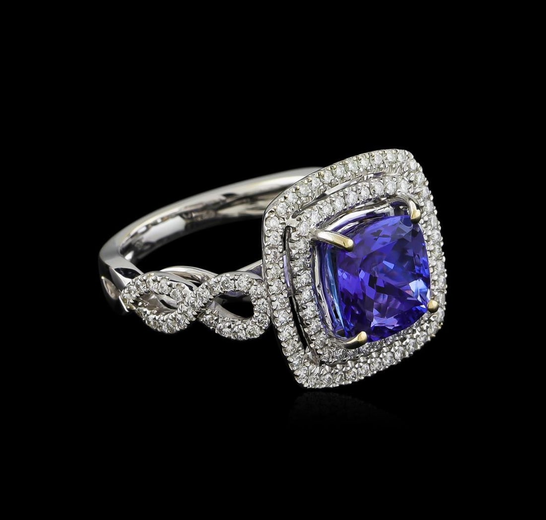 18KT White Gold 3.33 ctw Tanzanite and Diamond Ring: One electronically tested 18KT white gold ladies combination cast & assembled ring with a bright polish finish. Identified with markings of "750". Condition is new. Containing: One prong set square cu