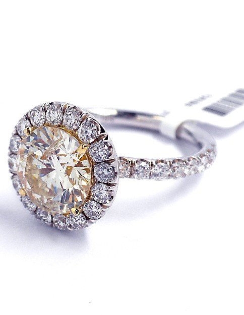18KT Yellow and White Gold 3.81ct Yellow Diamond Ring A: 18KT Yellow and White Gold 3.81ct Light Yellow Diamond Ring A3406. New Condition! IS1048PL. One elctronically tested 18KT two-tone, yellow and white gold ladies cast and assembled diamond ring. Good w