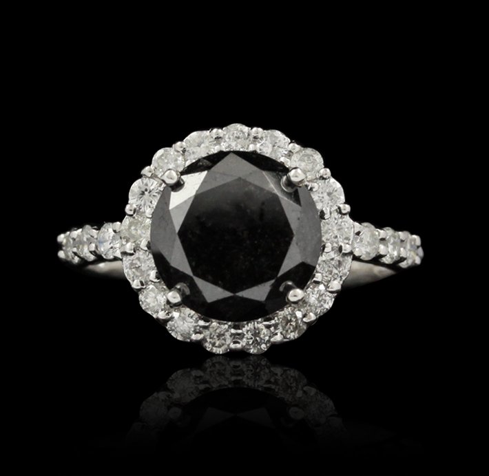 14KT White Gold 4.26ctw Black and White Diamond Ring RM: 14KT White Gold 4.26ctw Black and White Diamond Ring RM872. Excellent Condition! CQ918TH. One electronically tested 14KT white gold ladies cast black and white diamond ring with bright polish finish. 