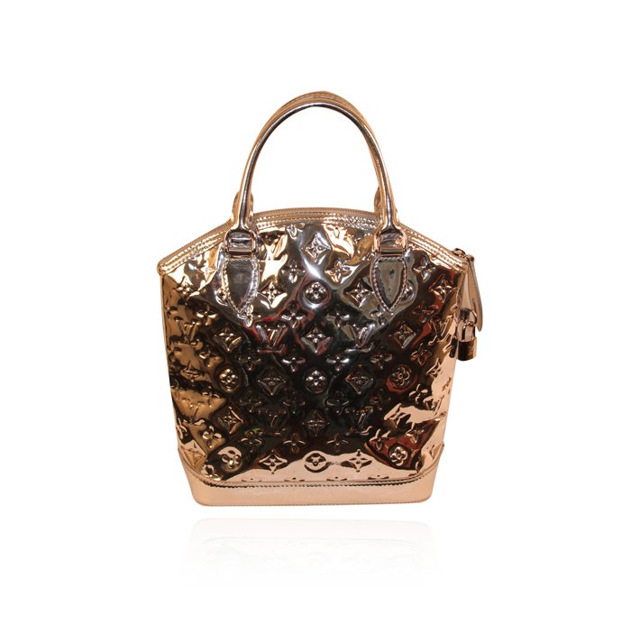 Authentic Louis Vuitton Monogram Miroir Lockit Vertical: Authentic Louis Vuitton Monogram Miroir Lockit Vertical Silver Handbag LB8. Good Pre-Owned Condition! OM3021UM. Louis Vuitton remains one of the world's most coveted symbols of status and sophisticati