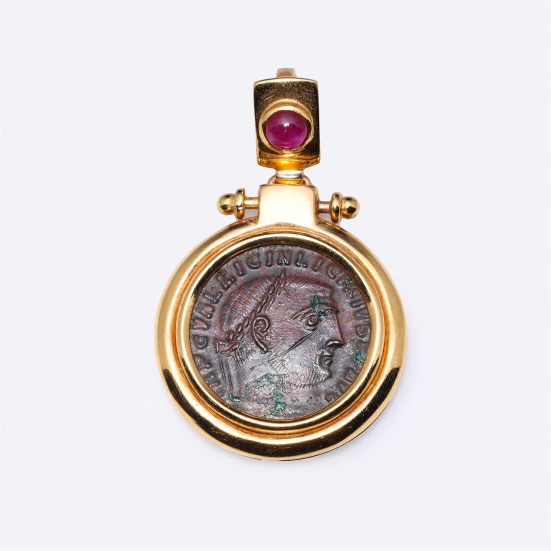 18K Yellow Gold Ruby & Ancient Roman Copper Coin Pendant: 18K Yellow Gold Ruby & Ancient Roman Copper Coin Pendant containing one ruby weighing approximately 0.20 cts. Total weight is 12 gm. Estimated retail value $2,100.