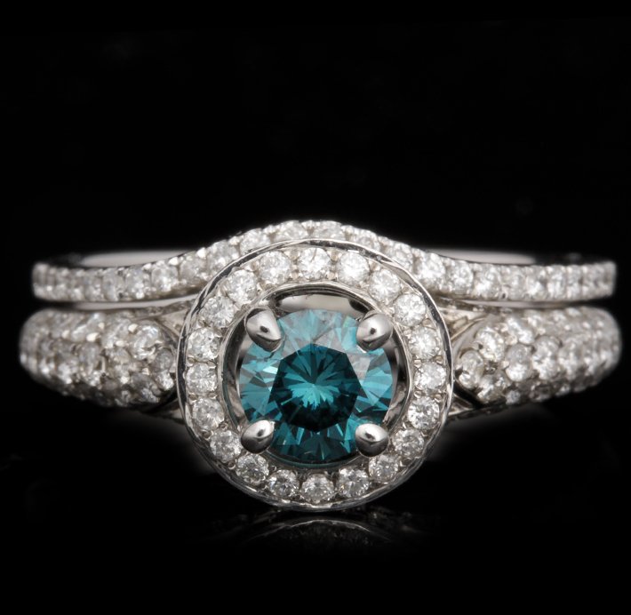 14KT White Gold 0.47ct Blue and White Diamond Wedding S: 14KT White Gold 0.47ct Blue and White Diamond Wedding Set FJM2492. Excellent Condition! YY977HS. One ring featuring: 4.64gm of 14KT white gold, (1) blue diamond with a total weight of 0.47ct and round