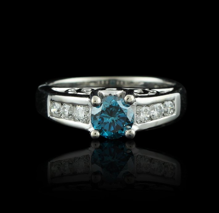 14KT White Gold 0.69ct Blue Diamond & White Diamond Rin: 14KT White Gold 0.69ct Blue Diamond & White Diamond Ring GB1434. Good condition! WP7411UB. One electronically tested 14KT white gold ladies cast & assembled diamond ring with a bright polish finish. C