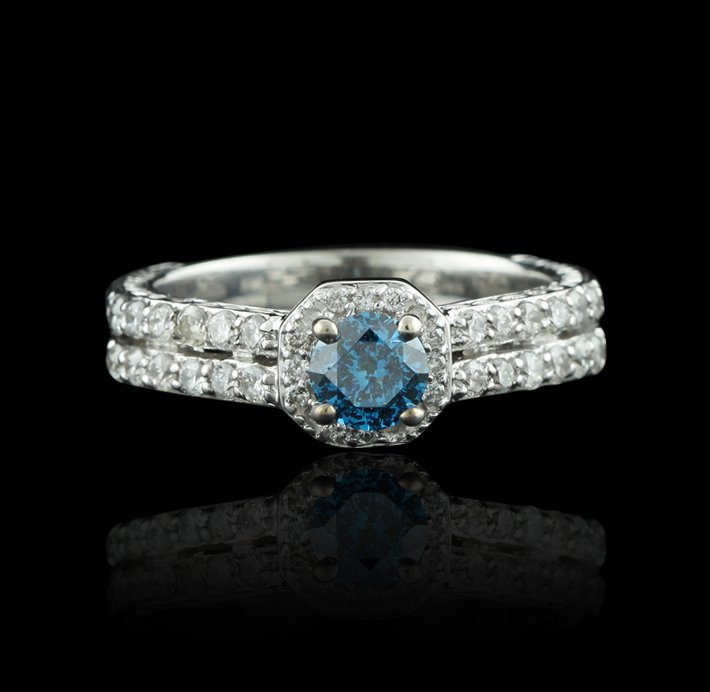 14KT White Gold 0.54ct Blue Diamond & White Diamond Rin: 14KT White Gold 0.54ct Blue Diamond & White Diamond Ring GB1428. Good condition! CJ7311DY. One electronically tested 14KT white gold ladies cast & assembled diamond unity ring. Condition is good. The 