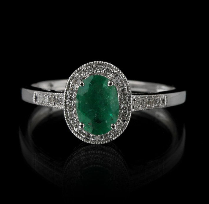 14KT White Gold 0.80ct Emerald and Diamond Ring FJM2280: 14KT White Gold 0.80ct Emerald and Diamond Ring FJM2280. Excellent Condition! GM942FS. One ring featuring: 1.82gm of 14KT white gold, (1) emerald with a total weight of 0.80cts and round cut diamonds