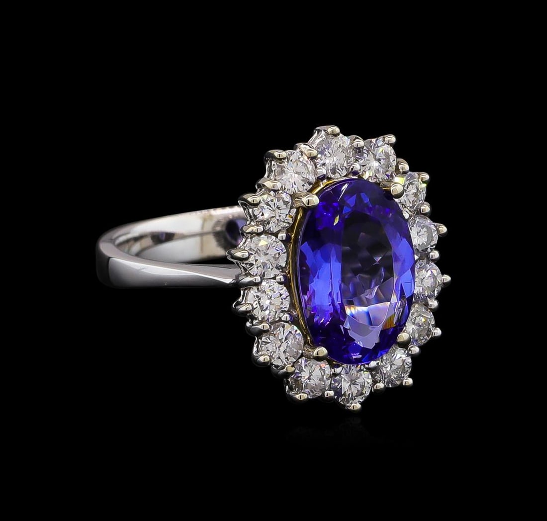 14KT Two-Tone Gold 2.38 ctw Tanzanite and Diamond Ring: One electronically tested 14KT white and yellow gold Ladies combination cast & assembled ring with a bright polish finish. Condition is new. Identified with markings of "14K". Containing: One prong se
