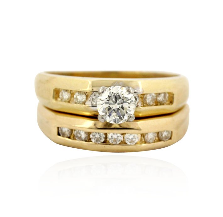 14KT Yellow Gold 0.60ctw Diamond Wedding Ring Set GB128: 14KT Yellow Gold 0.60ctw Diamond Wedding Ring Set GB1285. Great Condition! QE945DC. One ring set featuring: 5.5gm of 14KT yellow gold and diamonds with a total weight of 0.60ctw. Thank you for viewing