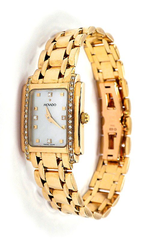 Movado 14KT Gold Ladies Diamond Wristwatch A3384: Movado 14KT Gold Ladies Diamond Wristwatch A3384. Great Condition! DL1561EA. One ladies, cast and die struck Movado tank style wristwatch electronically tested 14KT yellow gold. Bezel: diamond. Crysta