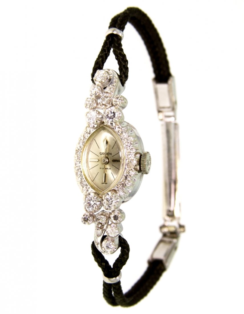 Ladies Vintage Gruen 14KT White Gold and Diamond Wristw: Ladies Vintage Gruen 14KT White Gold and Diamond Wristwatch GB1141. Great Condition! TN963FR. One ladies vintage Gruen 14KT white gold and diamond wristwatch. The watch features: black rope style brac