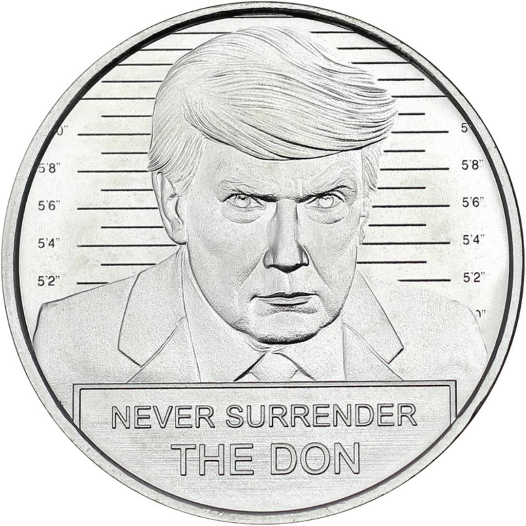 Donald Trump Mugshot 1oz .999 Fine Silver Coin: This Donald Trump Mugshot 1oz .999 Fine Silver Coin features a bold depiction of Trump in a mugshot-style design, complete with height markings and the phrase "Never Surrender The Don." Crafted from .