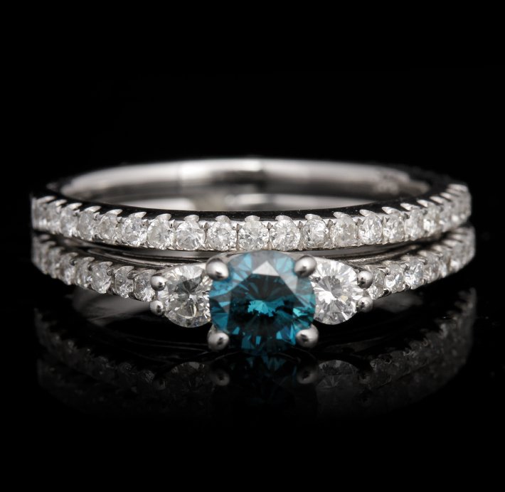 14KT White Gold 0.41ct Blue and White Diamond Wedding S: 14KT White Gold 0.41ct Blue and White Diamond Wedding Set FJM2491. Excellent Condition! PY975ET. One ring featuring: 4.70gm of 14KT white gold, (1) blue diamond with a total weight of 0.41ct and round